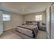 Nicely staged bedroom with hardwood floors, ceiling fan, and natural light at 912 Tree Garden Dr, Port Orange, FL 32127