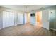 Spacious bedroom with hardwood floors, closet space, and an ensuite bathroom at 912 Tree Garden Dr, Port Orange, FL 32127