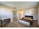 Bedroom area featuring a bed, desk, and mirrored sliding-door closet at 912 Tree Garden Dr, Port Orange, FL 32127