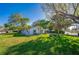 Single-story home with well-maintained lawn and mature trees at 912 Tree Garden Dr, Port Orange, FL 32127