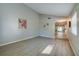 Open-concept living space with light wood floors at 912 Tree Garden Dr, Port Orange, FL 32127