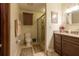 Bathroom featuring a vanity with granite countertop and a glass-enclosed shower at 929 Torchwood Dr, Deland, FL 32724