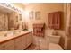 Comfortable bathroom featuring a sink with drawers and framed mirrors, complemented by coordinated towel sets and accents at 929 Torchwood Dr, Deland, FL 32724