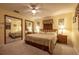 Bedroom featuring a cozy queen bed, mirrored closet doors, matching nightstands, and a ceiling fan at 929 Torchwood Dr, Deland, FL 32724