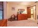 Bedroom featuring carpeted floors, blinds, wooden doors, and a matching wood dresser at 929 Torchwood Dr, Deland, FL 32724
