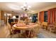 Open dining area adjacent to the living room offers wood-look flooring and cozy, bright atmosphere at 929 Torchwood Dr, Deland, FL 32724