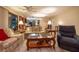 Spacious living room features wood-look flooring and comfortable furniture for relaxing and entertaining guests at 929 Torchwood Dr, Deland, FL 32724