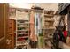 Organized walk-in closet features built-in shelving for shoes, clothing, bags, and accessories providing ample storage at 929 Torchwood Dr, Deland, FL 32724