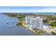 An aerial view of two condo buildings on the water featuring a pool and access to a pier at 935 N Halifax Ave # 309, Daytona Beach, FL 32118