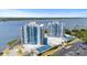 An aerial view of two condo buildings with tennis courts and water views at 935 N Halifax Ave # 309, Daytona Beach, FL 32118
