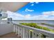 Wonderful balcony view of the open water and nearby parks with white railings and ample space for relaxation at 935 N Halifax Ave # 309, Daytona Beach, FL 32118