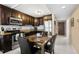 A kitchen with dark wood cabinets, stainless steel appliances, and a granite countertop is ready for use at 935 N Halifax Ave # 309, Daytona Beach, FL 32118