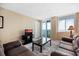 Relaxing living room with balcony access, large windows, and comfortable seating at 935 N Halifax Ave # 309, Daytona Beach, FL 32118