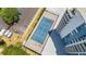 Overhead view of a well-maintained tennis court adjacent to the building and parking area at 935 N Halifax Ave # 309, Daytona Beach, FL 32118