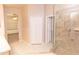 Bright bathroom featuring tile floors, a glass shower, and double closets for storage at 1222 Brandy Lake View Cir, Winter Garden, FL 34787