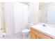 Well-lit bathroom featuring a shower/tub combo, toilet, vanity with sink and cabinet at 1222 Brandy Lake View Cir, Winter Garden, FL 34787