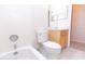 Clean bathroom features a toilet, shower/tub combo, and a vanity with sink and cabinet at 1222 Brandy Lake View Cir, Winter Garden, FL 34787