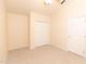 Cozy bedroom features carpeted floors, a ceiling fan, and a closet with bi-fold doors at 1222 Brandy Lake View Cir, Winter Garden, FL 34787