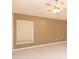 Bright bedroom featuring a ceiling fan, neutral walls, and a large window with a shade at 1222 Brandy Lake View Cir, Winter Garden, FL 34787
