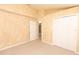 Spacious bedroom features neutral decor, carpeted floor, and a closet for ample storage at 1222 Brandy Lake View Cir, Winter Garden, FL 34787