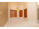 Dining area with tiled floors, neutral wall paint, and large windows with privacy blinds at 1222 Brandy Lake View Cir, Winter Garden, FL 34787