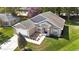 Inviting single-story home featuring a well-maintained lawn, a two-car garage and manicured landscaping at 1222 Brandy Lake View Cir, Winter Garden, FL 34787