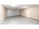 Spacious two-car garage with overhead lighting and ample room for storage at 1222 Brandy Lake View Cir, Winter Garden, FL 34787