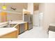 Open-concept kitchen features light-colored cabinets and stainless-steel appliances at 1222 Brandy Lake View Cir, Winter Garden, FL 34787