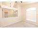 Comfortable living room features a ceiling fan, neutral walls, and carpeted floors at 1222 Brandy Lake View Cir, Winter Garden, FL 34787