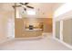 Open living space with kitchen bar, vaulted ceilings, and access to the back patio at 1222 Brandy Lake View Cir, Winter Garden, FL 34787