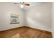 Bedroom with hardwood floors, a window, and a ceiling fan at 1227 Baypoint Ct, Longwood, FL 32750