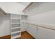 Walk-in closet featuring wooden shelves and racks at 1227 Baypoint Ct, Longwood, FL 32750