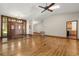 Inviting foyer with elegant wood double doors, hardwood flooring, and views of the kitchen and hallways at 1227 Baypoint Ct, Longwood, FL 32750