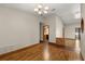 Spacious living room with hardwood flooring, recessed lighting, and a charming brick accent wall at 1227 Baypoint Ct, Longwood, FL 32750