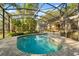 Enjoy this crystal blue pool, surrounded by brick pavers and lush landscaping in screened enclosure at 1227 Baypoint Ct, Longwood, FL 32750