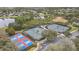 Aerial view of tennis courts, pickleball courts, and parking lot at 1386 Hazeldene Mnr, Deland, FL 32724