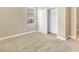 Cozy bedroom with carpet, large window, and closet at 1386 Hazeldene Mnr, Deland, FL 32724