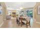 Spacious dining area seamlessly flowing into the living room with access to the lanai at 1386 Hazeldene Mnr, Deland, FL 32724