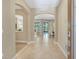 Elegant foyer with tile flooring, arched doorways, and a view into the living spaces at 1386 Hazeldene Mnr, Deland, FL 32724
