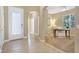 Welcoming entryway with tile flooring leading to a carpeted office space with ample natural light at 1386 Hazeldene Mnr, Deland, FL 32724
