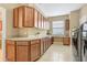 Spacious laundry room featuring ample counter space, lots of cabinets, and modern appliances at 1386 Hazeldene Mnr, Deland, FL 32724