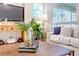 Bright living room with stylish decor, large windows, and a cozy atmosphere at 1386 Hazeldene Mnr, Deland, FL 32724