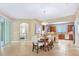 Open concept living space with dining area, kitchen, and access to the lanai at 1386 Hazeldene Mnr, Deland, FL 32724