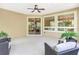 Spacious screened patio with comfortable seating and views of the lush backyard at 1386 Hazeldene Mnr, Deland, FL 32724