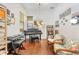 Versatile bonus room featuring a piano and a comfortable seating area with lots of natural light at 1684 Victoria Gardens Dr, Deland, FL 32724