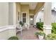 Cozy front porch with seating and a decorative wreath, creating a welcoming entrance to the home at 1684 Victoria Gardens Dr, Deland, FL 32724
