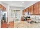 Well-appointed kitchen featuring granite counters, stainless appliances, and an eat-in dining area at 1684 Victoria Gardens Dr, Deland, FL 32724