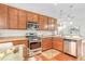 Well-equipped kitchen featuring stainless appliances and wood cabinets at 1684 Victoria Gardens Dr, Deland, FL 32724