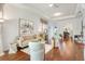Bright and airy living room showcases stylish decor, hardwood floors, and a comfortable seating arrangement at 1684 Victoria Gardens Dr, Deland, FL 32724