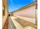 Spacious backyard with a walkway and rock landscaping is perfect for outdoor activities at 1711 Francisco St, The Villages, FL 32159